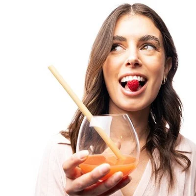 Girl drinking Berries low FODMAP gut health powder.jpg