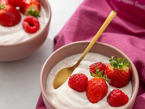 Lactose free yoghurt with Berries Boost and some low FODMAP berries in a bowl