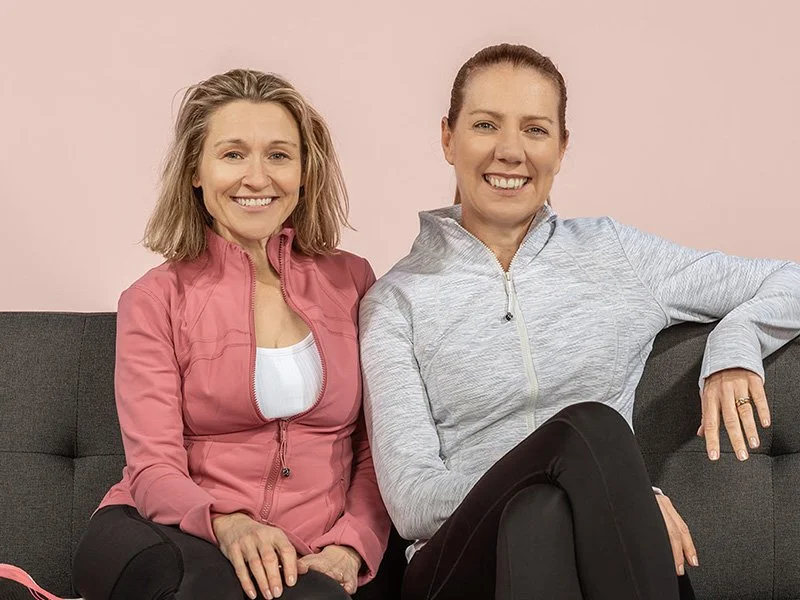 Mary Webberley and Josephine Muir sitting on a sofa
