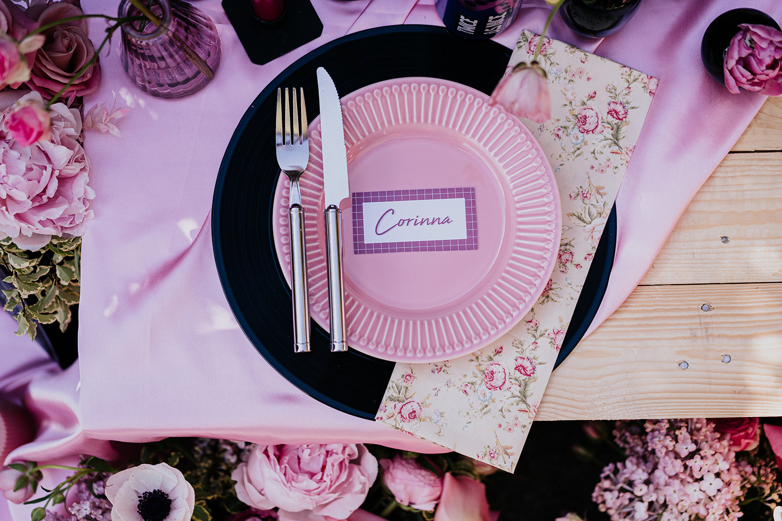pink table setting with record placemats