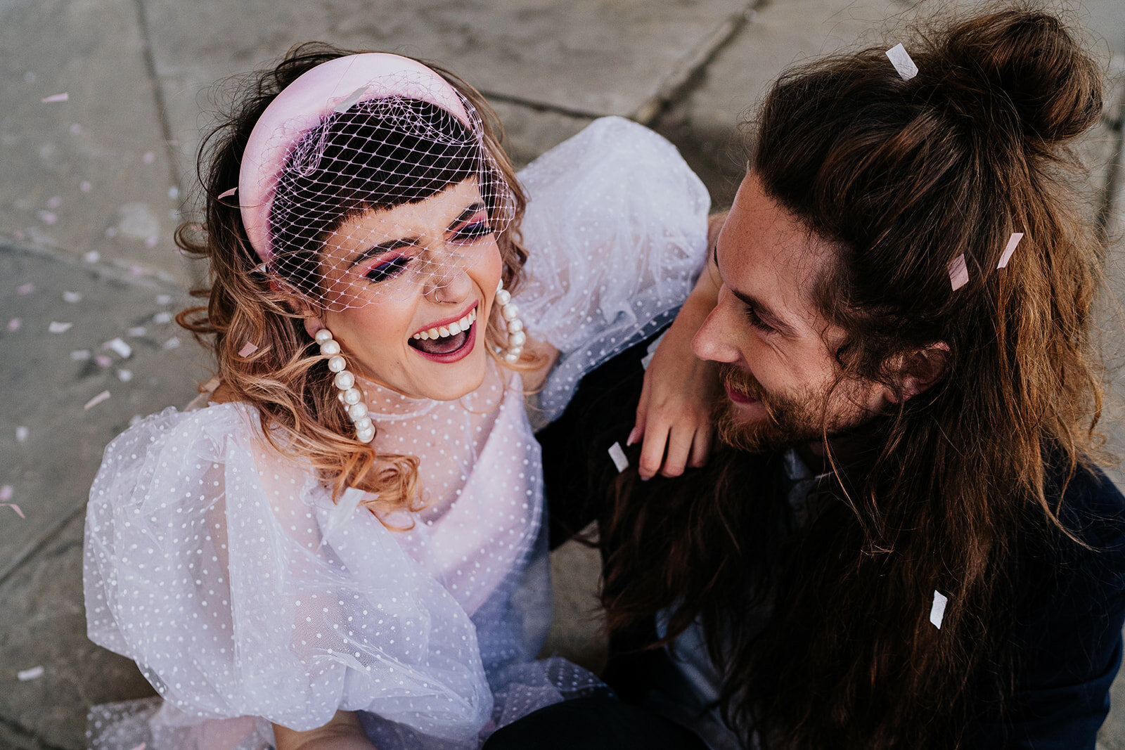 an overhead shot of a bride and groom laughing
