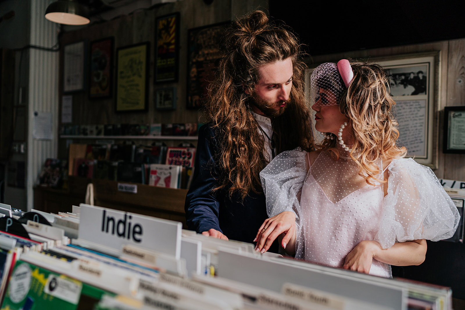 a bride and groom shop for records on their wedding day