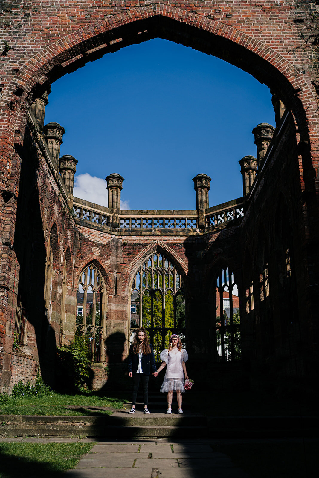 bride and groom at the bombed out church