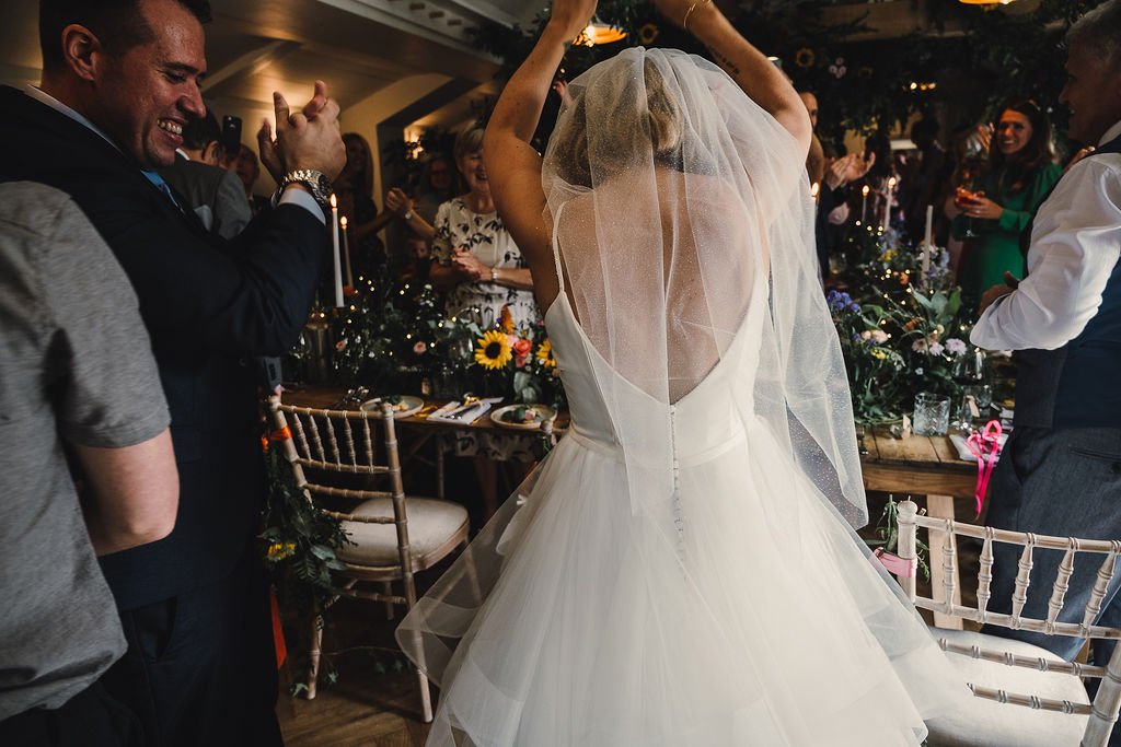 the back of a bride and her veil