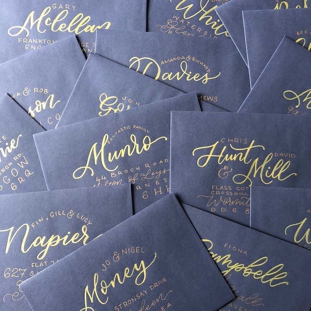  Navy envelopes with beautiful gold calligraphy for names and addresses.  
