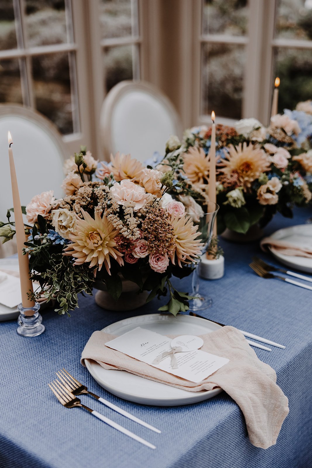  Showcasing the details of the wedding flowers and wedding breakfast table that are captured by wedding content creator as a reel for the couple to cherish forever.  Photo by: Megan Melissa Photography 