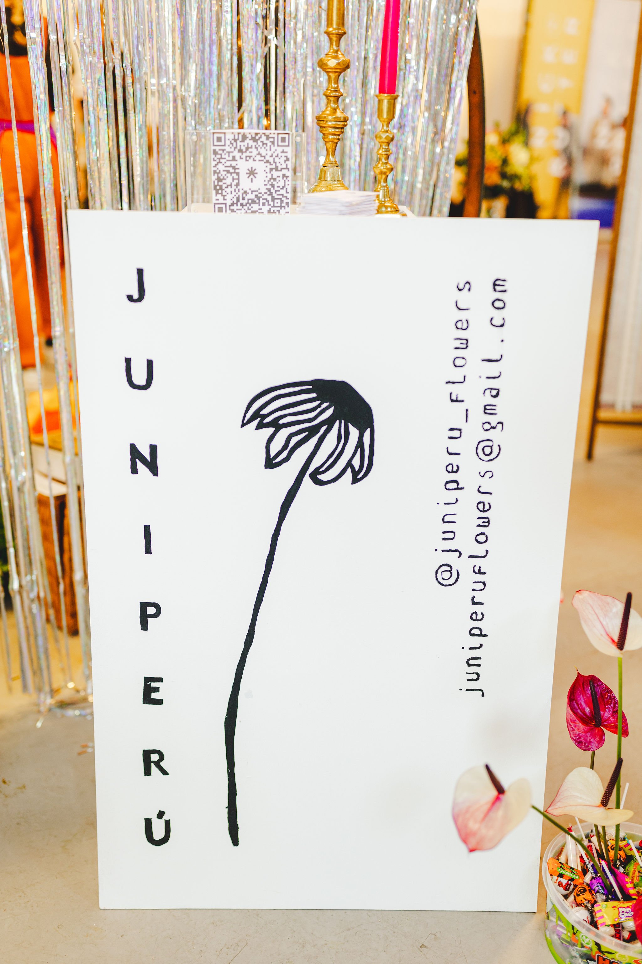  Hand painted sign by owner of Juniperu, a modern floral designer for weddings, displayed at The Un-Wedding Show Bristol. 