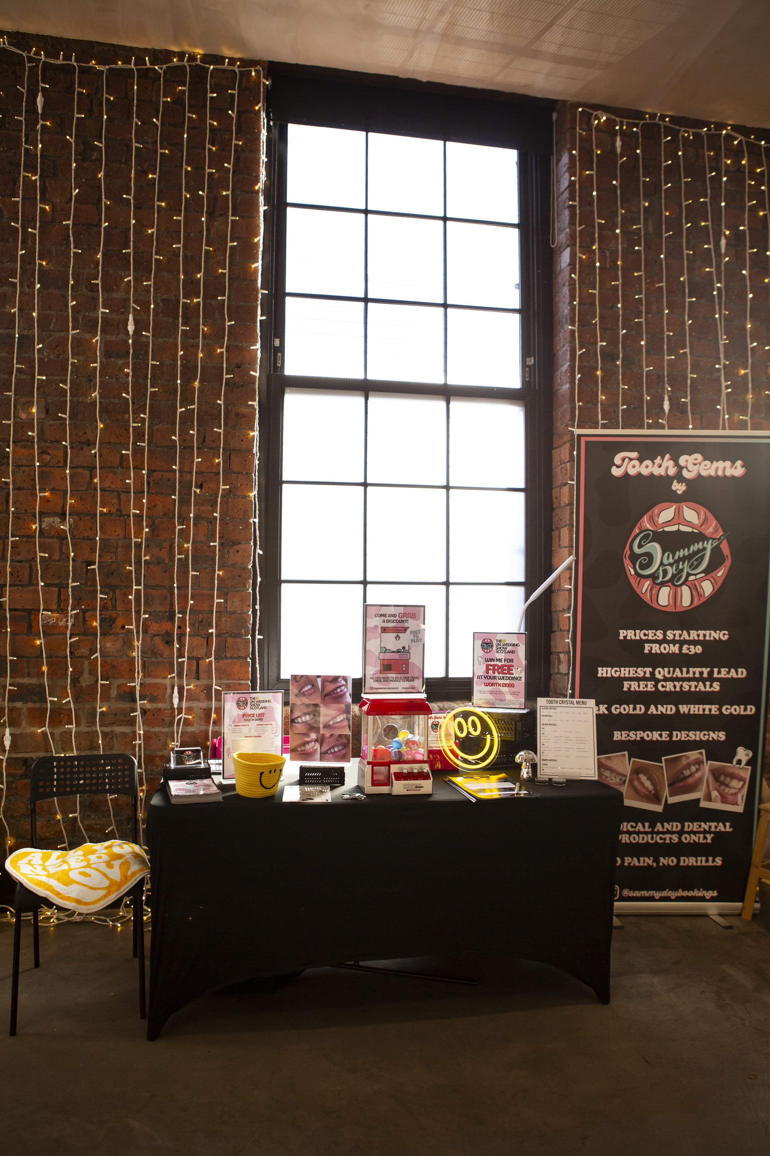  Cool setup by supplier Sammy Dey with the beautiful exposed brick of The Engine Works covered in hanging fairy lights behind. 