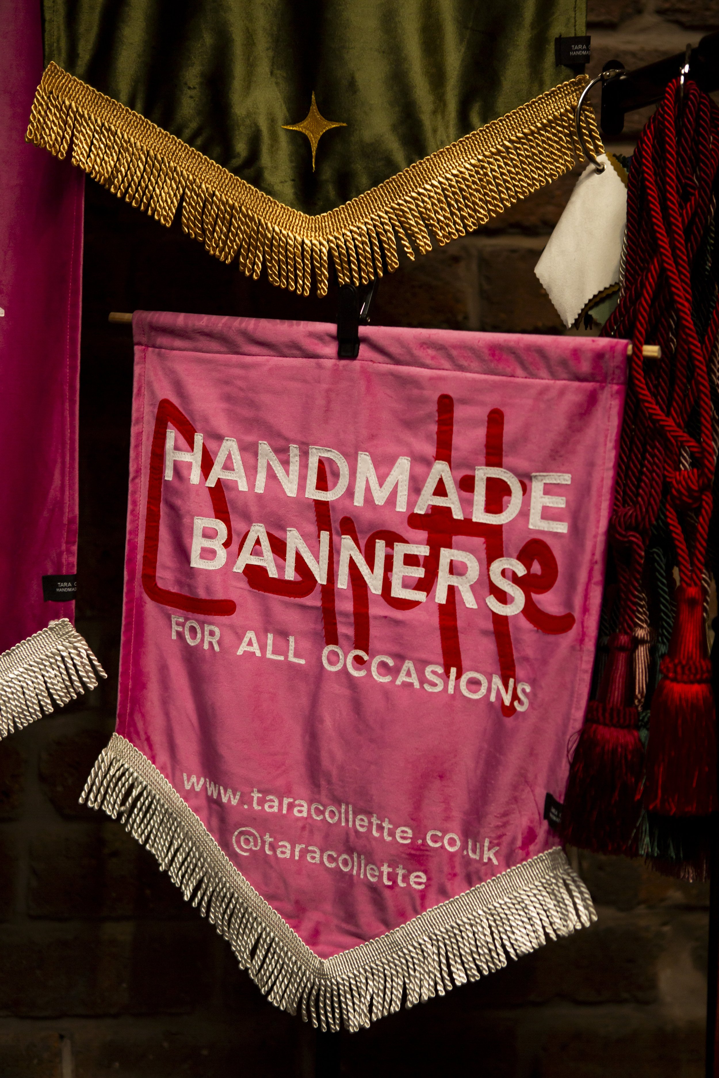  A large pink velvet TARA COLLETTE handmade wedding banner displayed at The Un-Wedding Show Scotland. 
