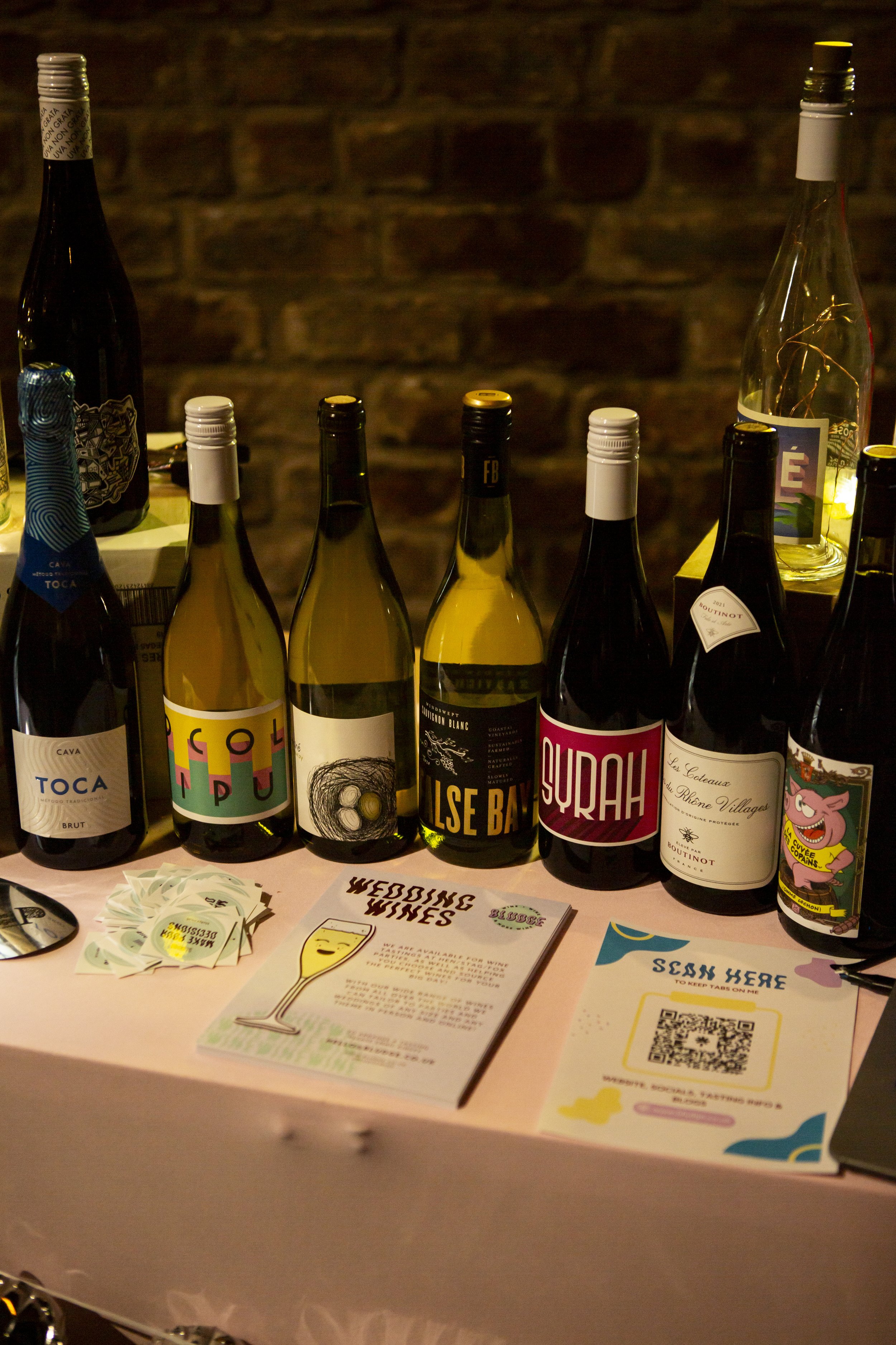  Modern selection of wedding wines displayed in front of the exposed brick of the The Engine Works wedding venue. 