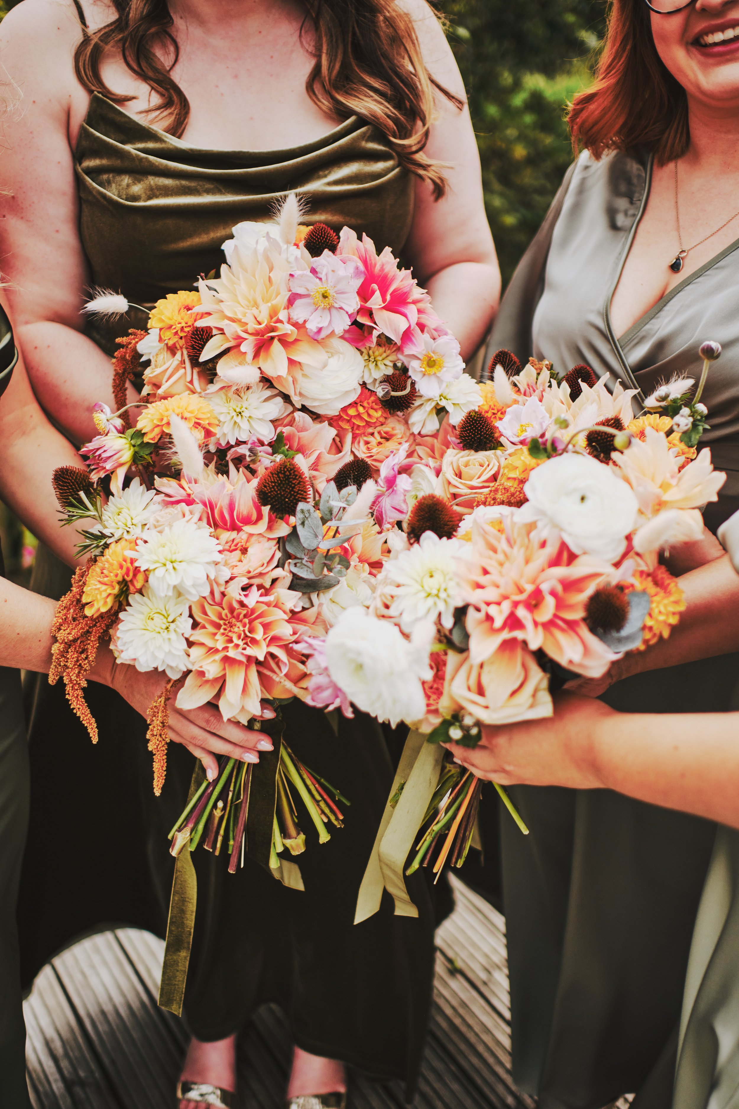  An up close image of the beautiful textures and colours of the bride and bridesmaids bouquets which are being held together.  Photo by Kuva Wedding Photography 