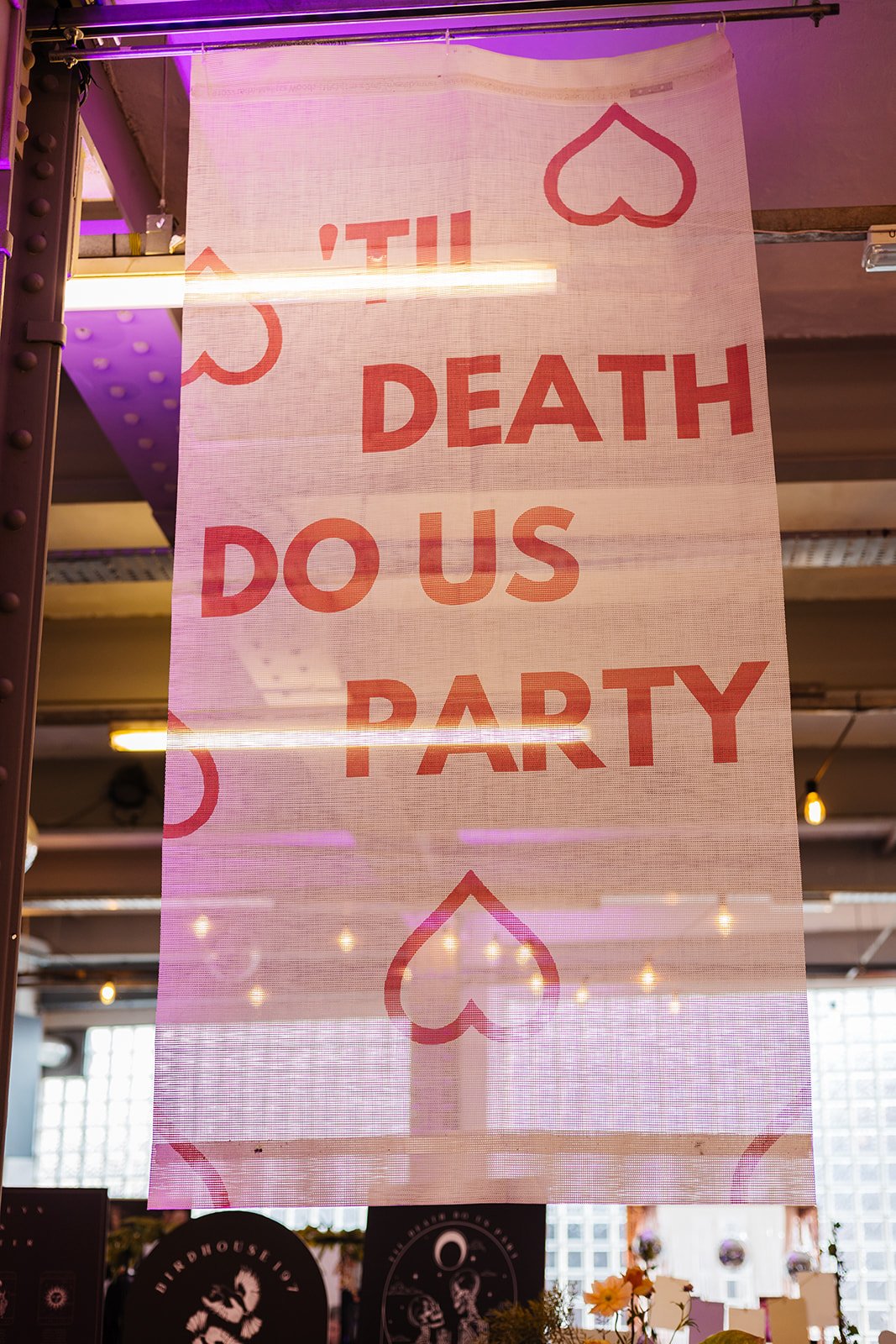  A pink and red ‘Til Death Do Us Party’ banner at The Un-Wedding Show in Sheffield. 