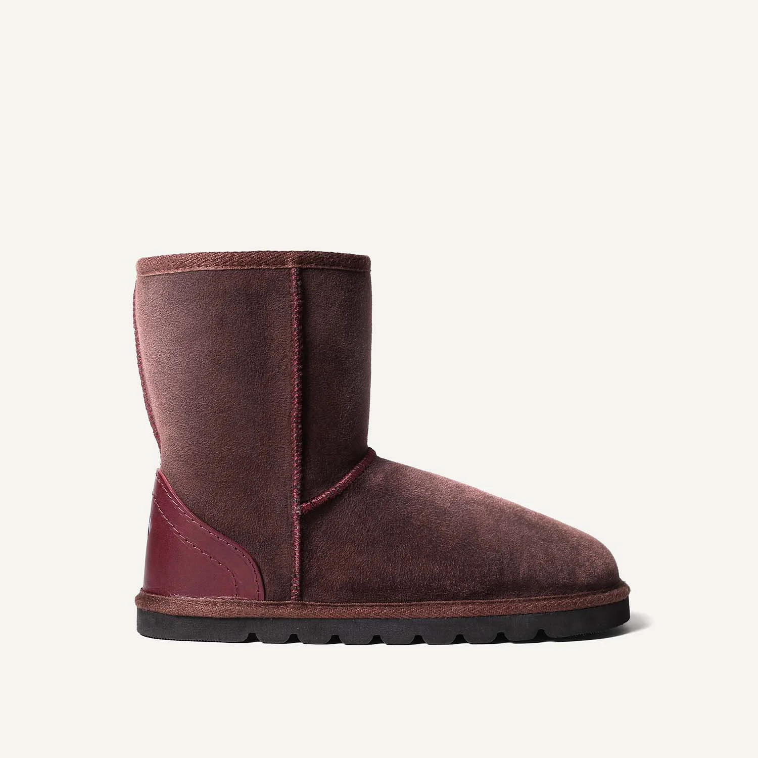 A brown sheepskin boot seen from the side.