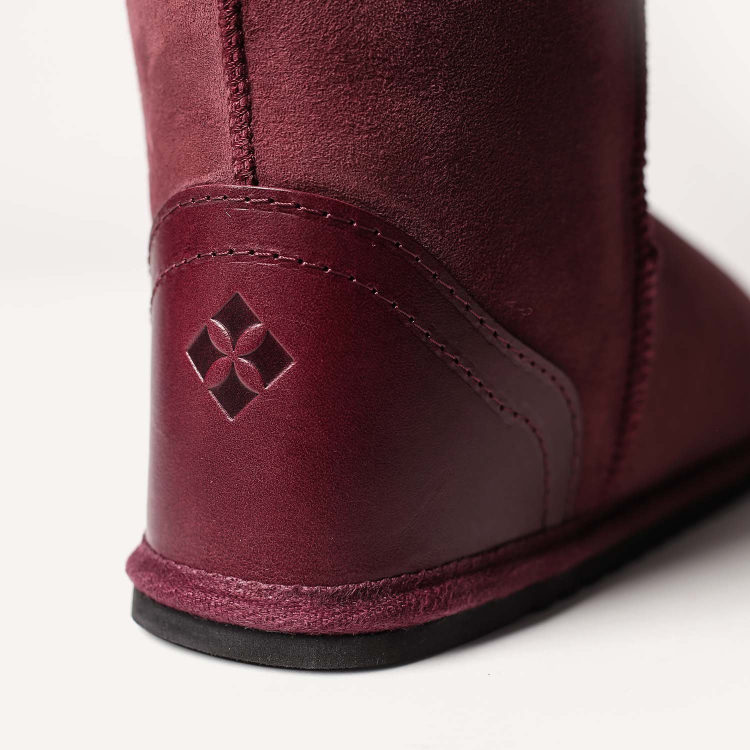 Close up of a veg tanned leather heel on a handmade sheepskin boot