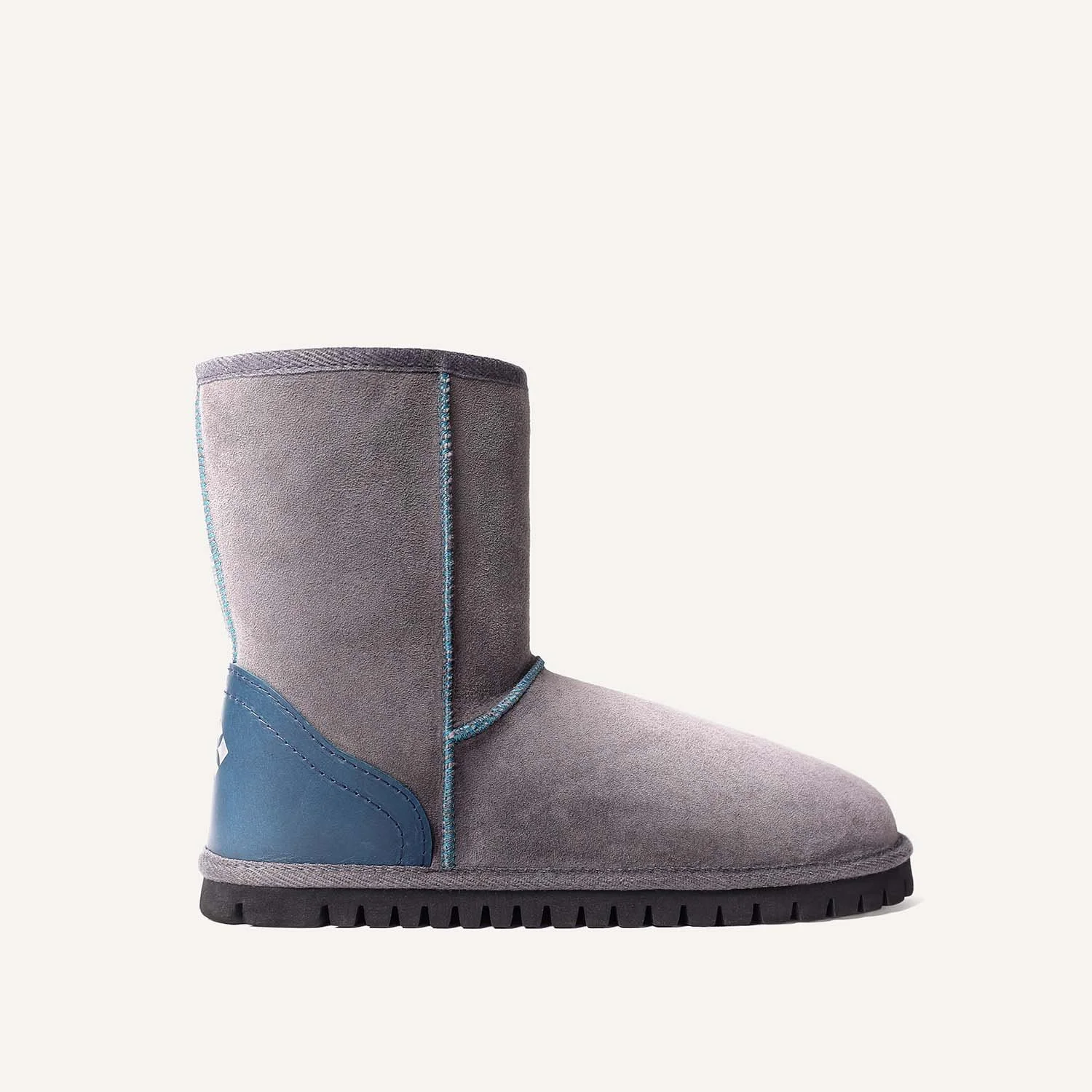 Side view of size 9 grey and teal sheepskin boot.