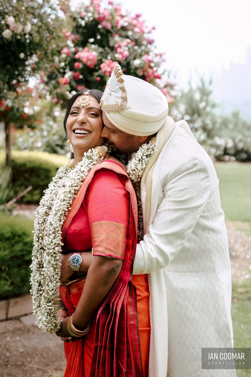 shri-shiva-vishnu-temple-wedding-groom-kiss-bride.jpg
