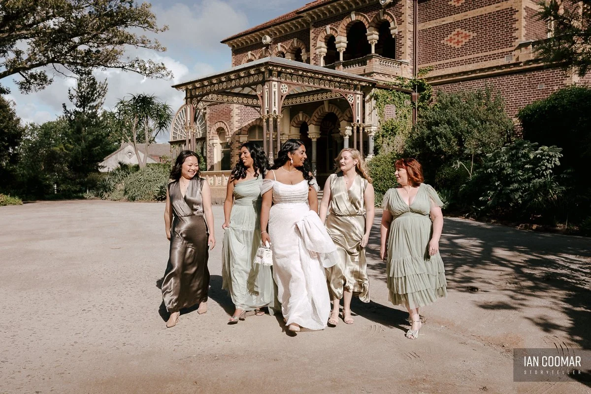 rippon-lea-estate-wedding-bridesmaids-walking.jpg