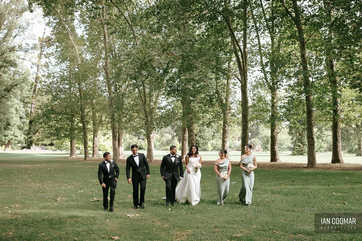 lincoln-of-toorak-wedding-bridal-party-walking.jpg