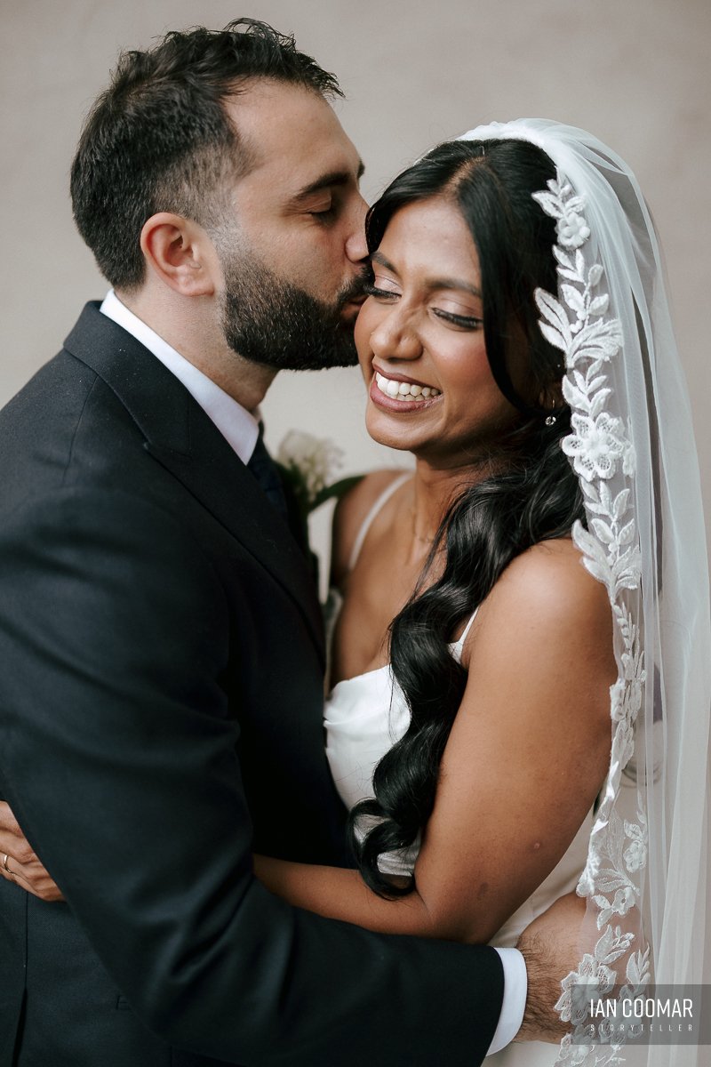 sheldon-reception-wedding-groom-kiss-bride-fitzroy-town-hall.jpg