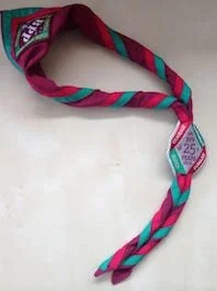 Our scarf, group badge, and special edition silver jubilee woggle badge.
