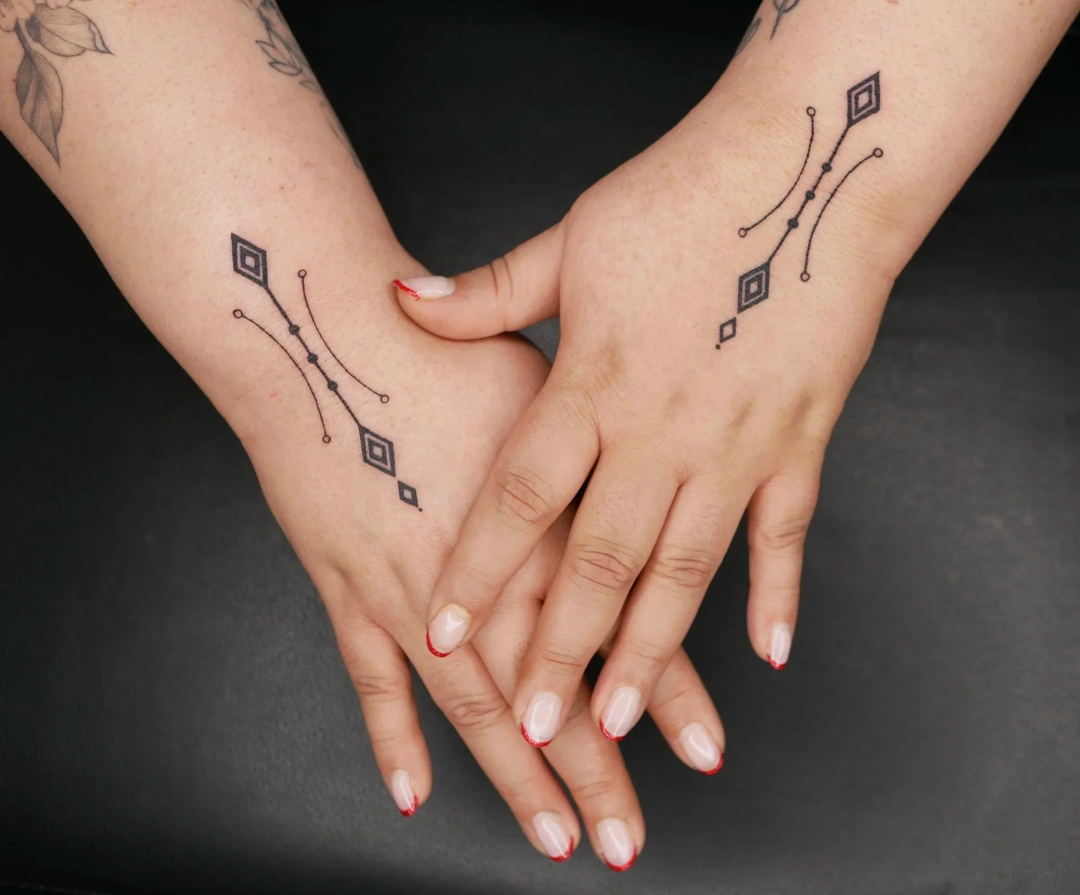 Symmetrical patterns on hands
Fineline Tattoo
2026
