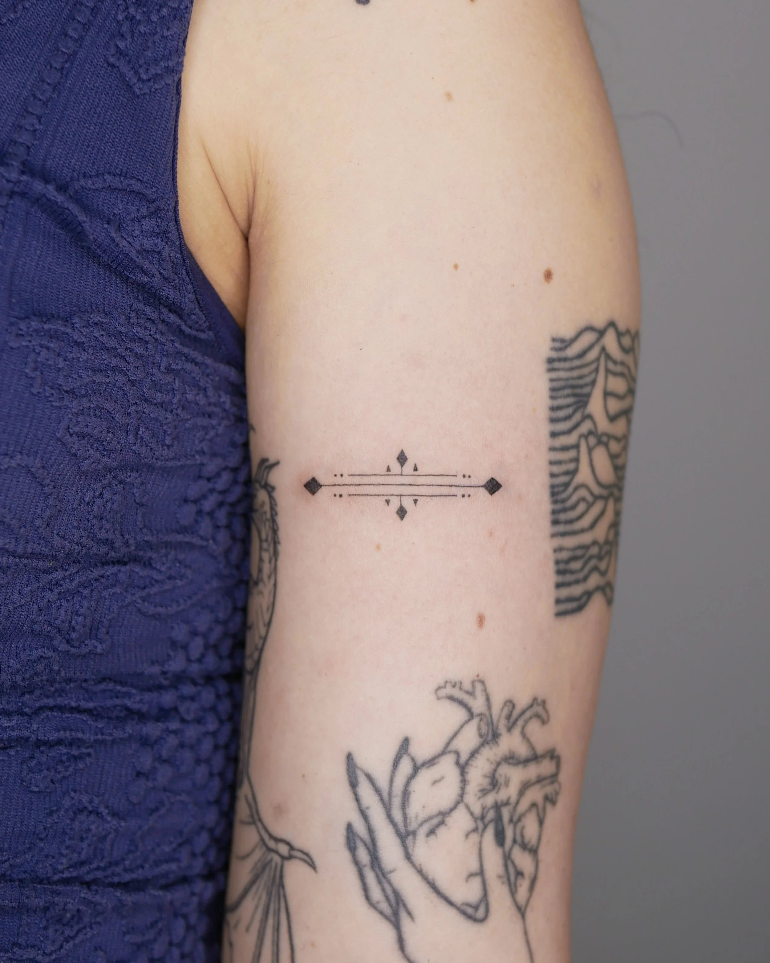 Pattern on bicep
Fineline tattoo
2026