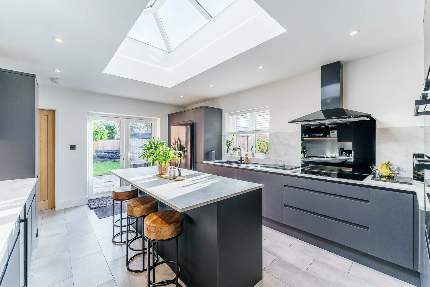 Real estate professional photograph highlighting kitchen area with skylight