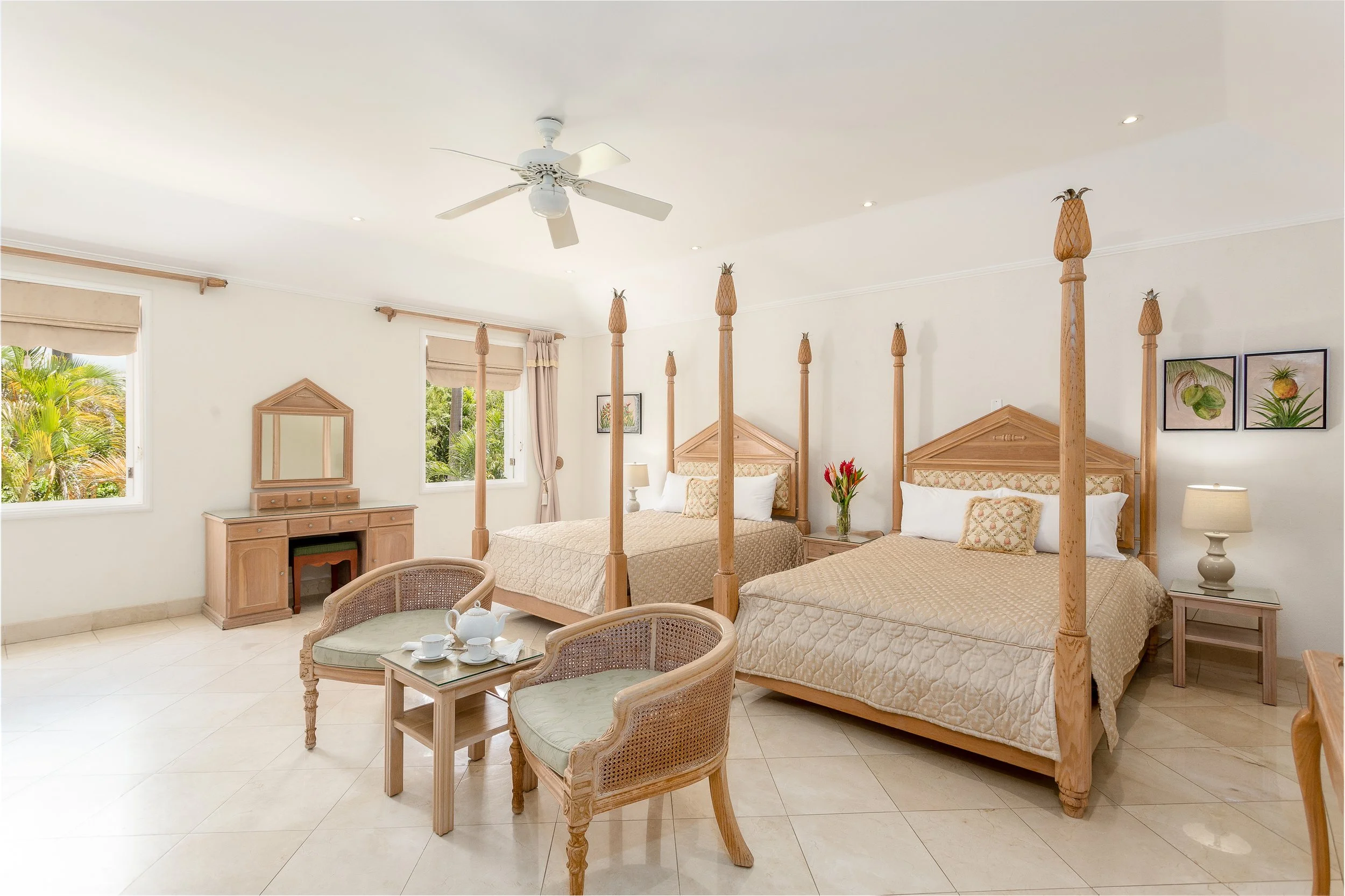 Green Monkey Room at Bohemia Sandy Lane — upper floor bedroom with two four-poster beds overlooking the gardens