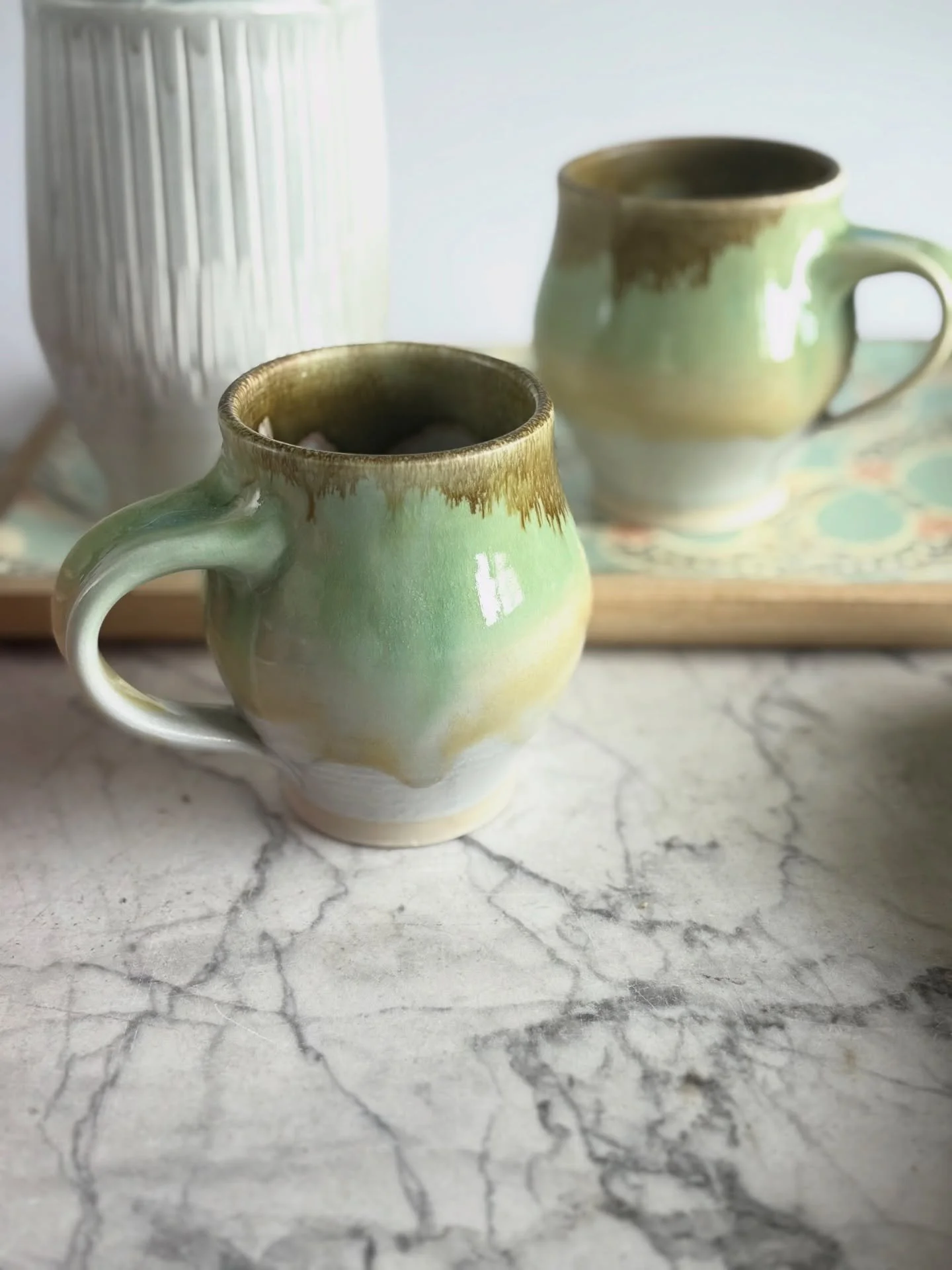 It&rsquo;s a rainy, snowy, rainy Sunday here, but I couldn&rsquo;t wait to share some Spring color with you. These mugs have multiple glazes layered over my matte white to get the soft pastel fade. I have pink or white flower flights and pomegranates