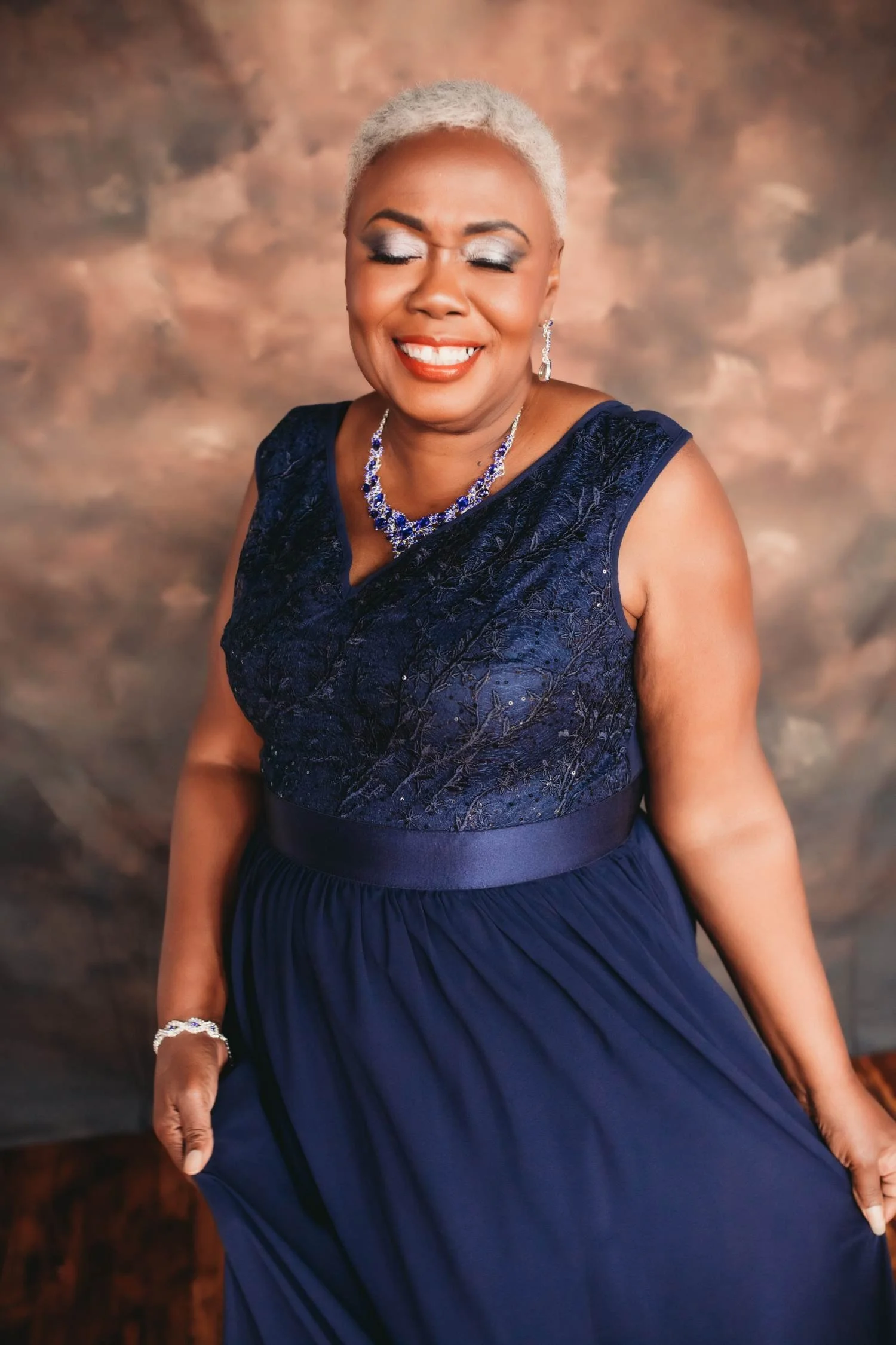Ms V boudoir portrait session in blue gown photographed in Boston MA.