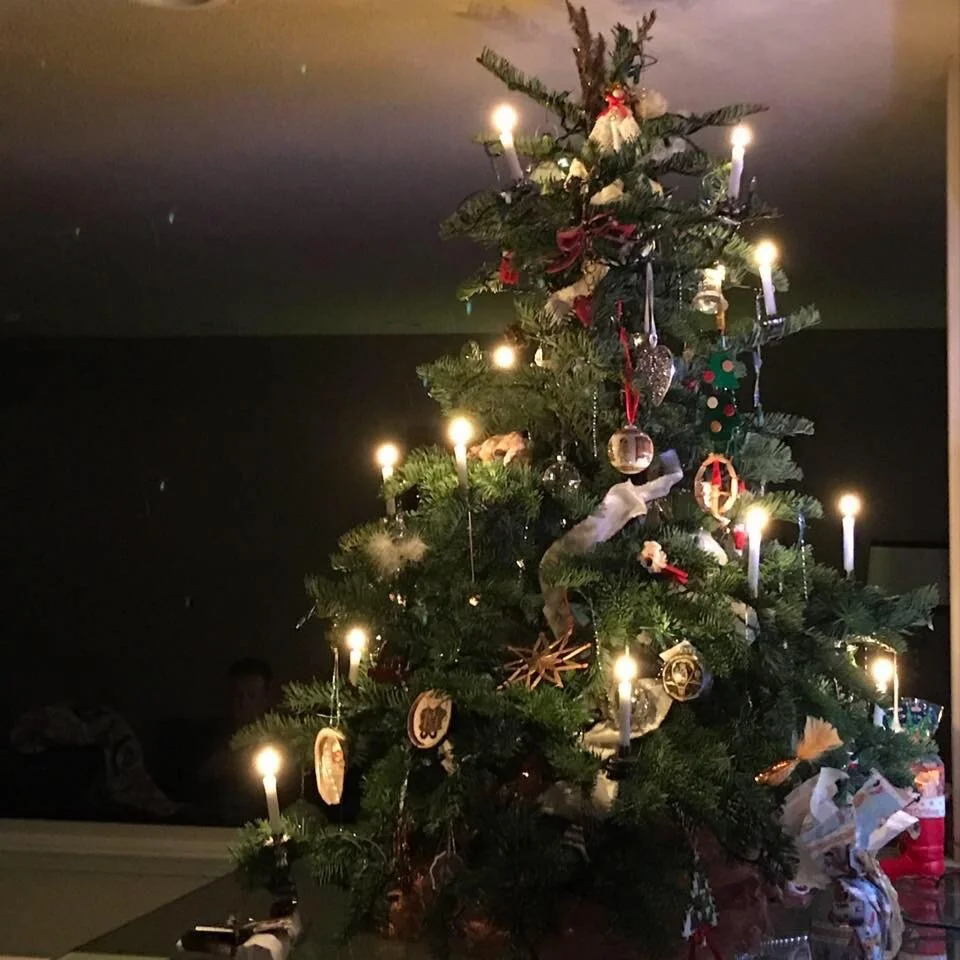 Our family Christmas Tree 
[yes those candles are real]