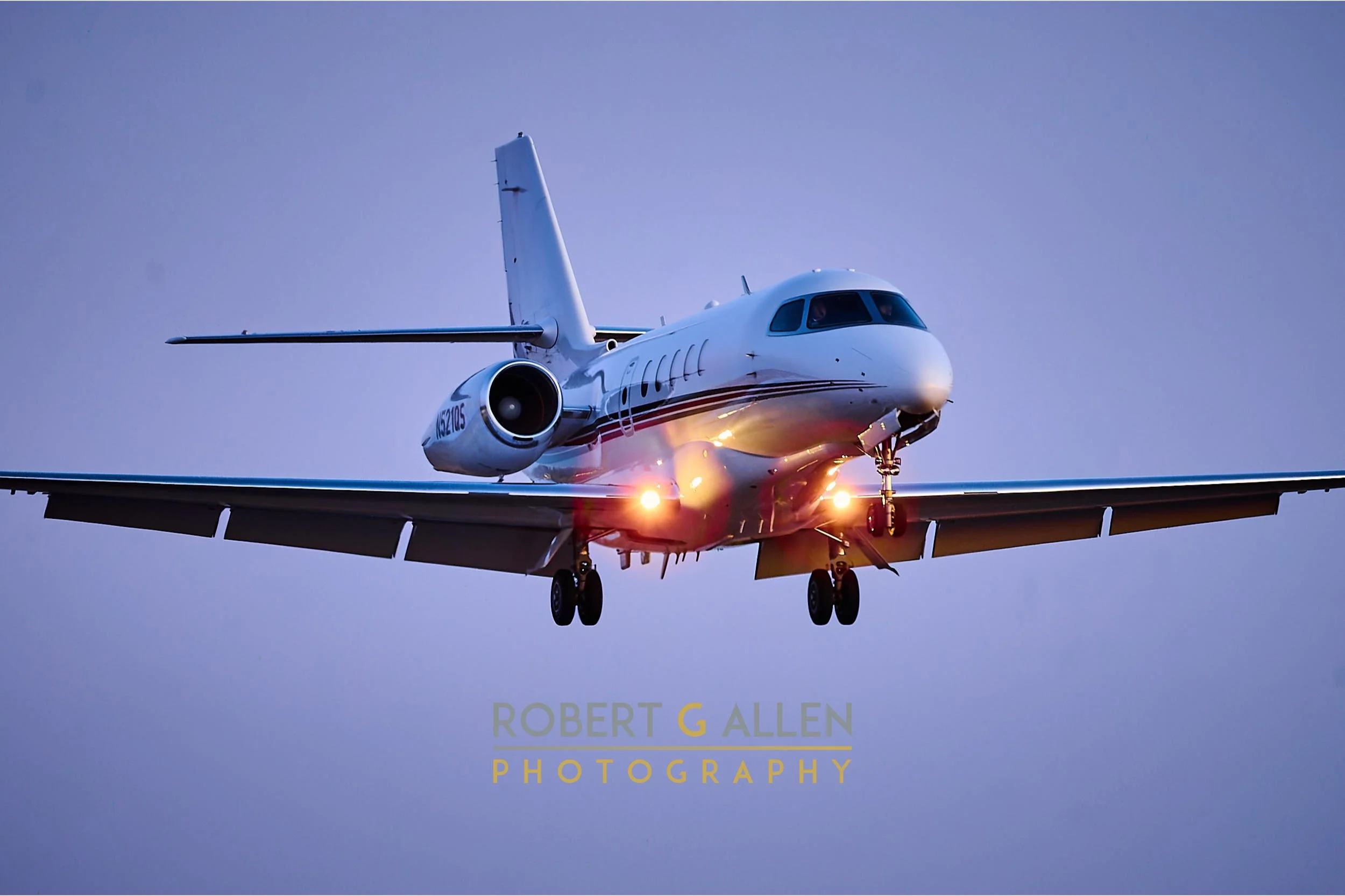 A Cessna Citation Latitude 680A on final approach
