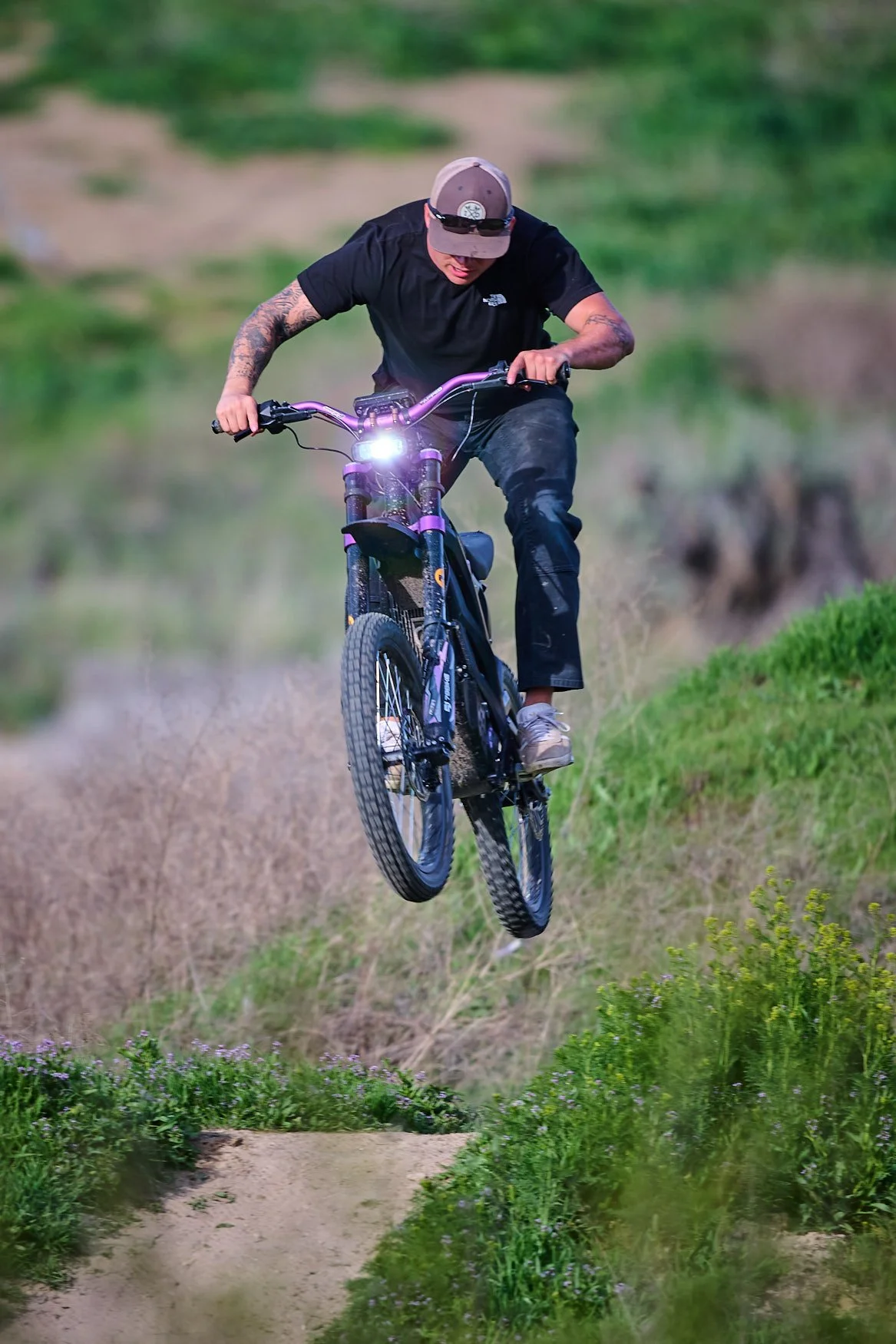 BMX rider jumping a hill