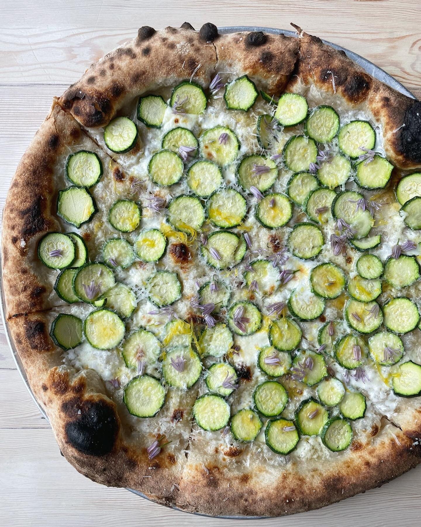 Whole pizzas available for dine in or takeout from 3pm to 9pm &hellip; including this zucchini pie with garlic cream, calabrian chili, sheep cheese, mozzarella, and lemon.