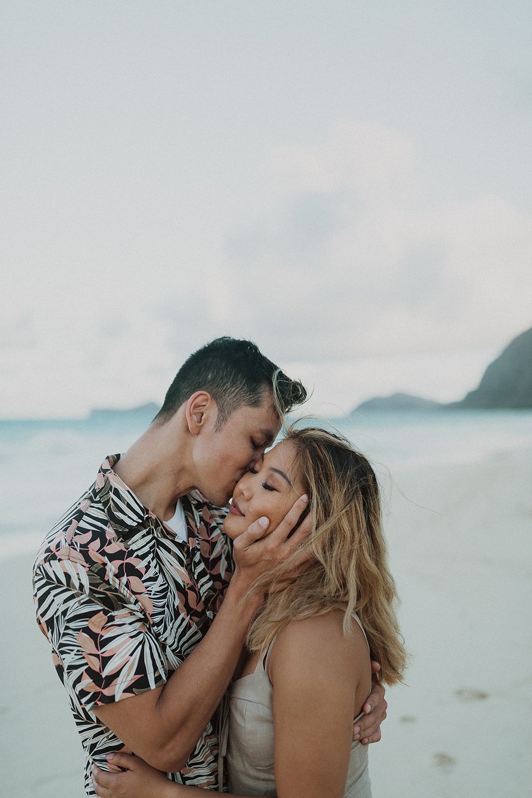Couple romantic pose at the beach Stock Photos - Page 1 : Masterfile