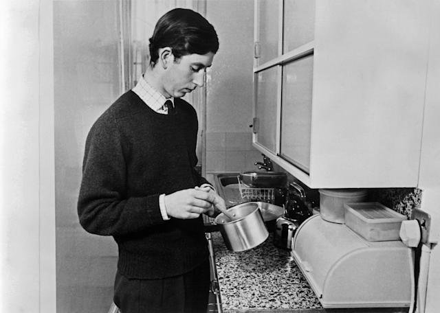 cooking a meal on 8 February 1971. (AFP via Getty Images)