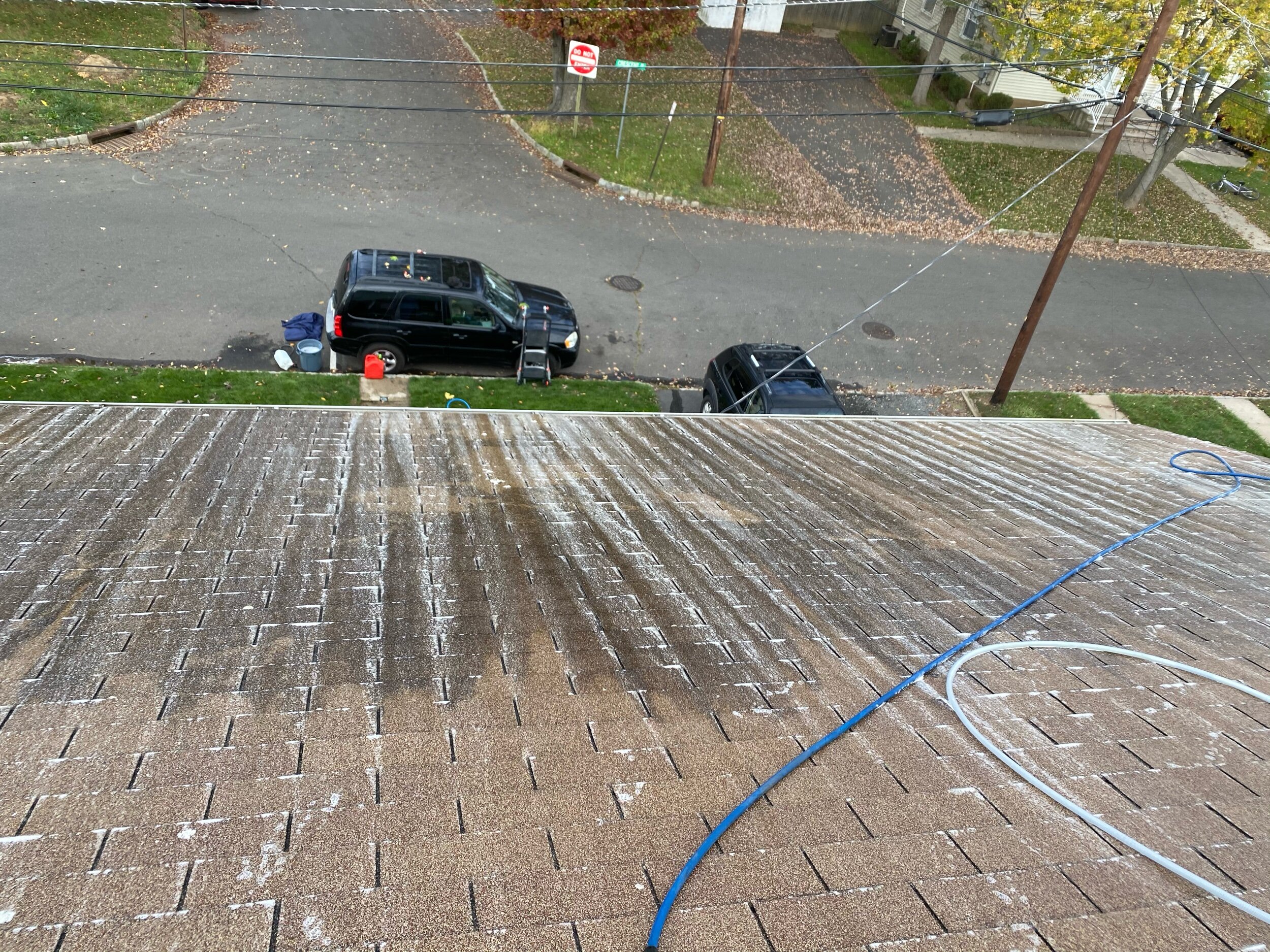 cleaning off the black streaks of a dirty roof