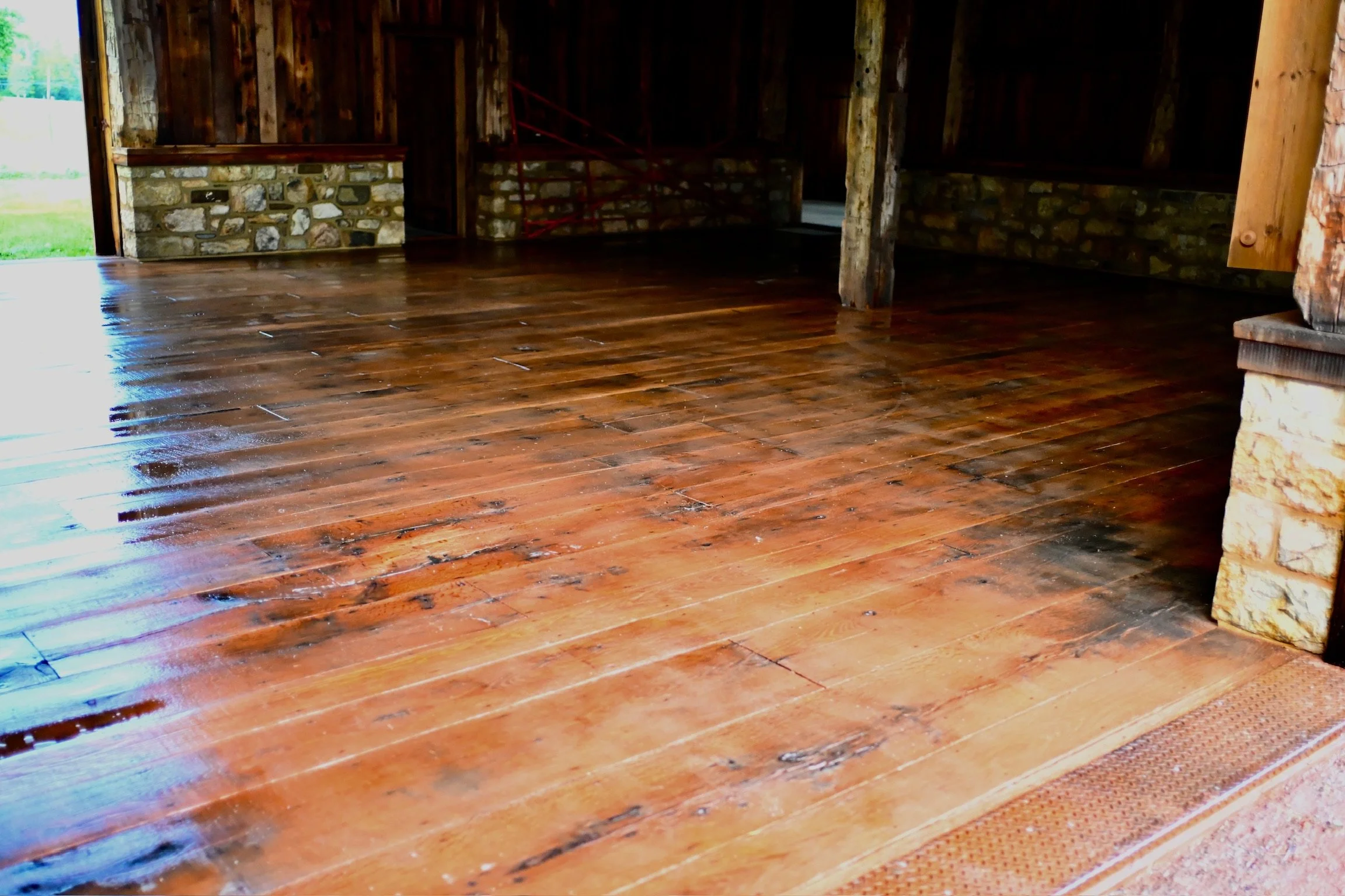 Power washing a barn floor to remove barnswallow droppings in NJ
