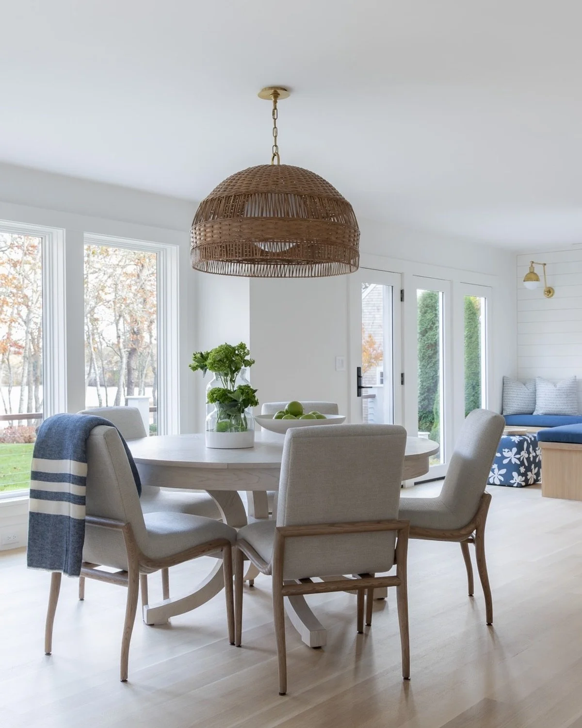 A dining space made for gathering. This round dining table expands to accommodate many guests.