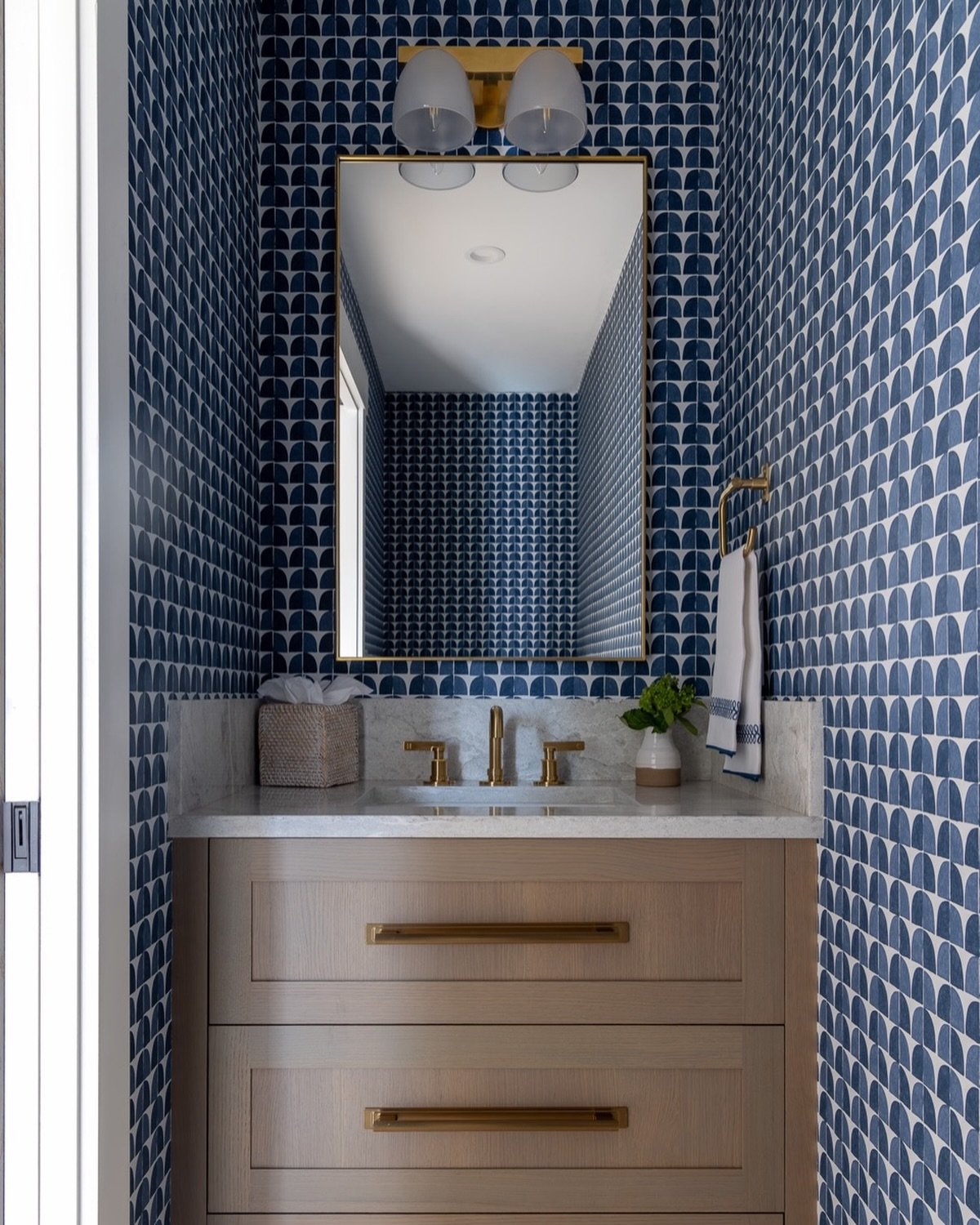 Fun wallpaper in this powder room!