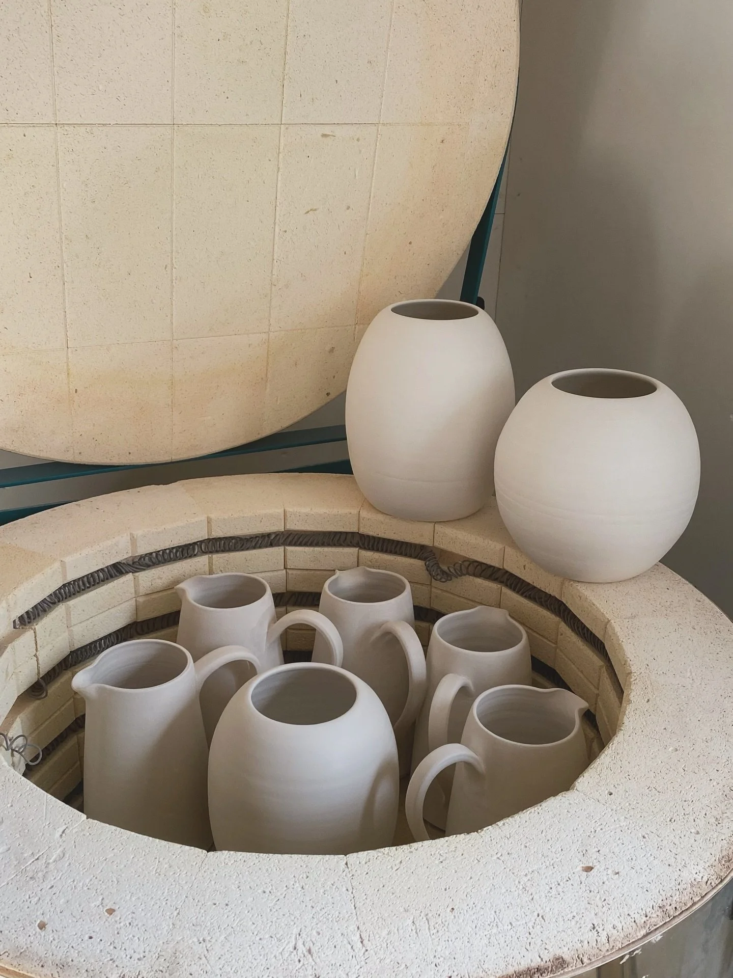So thrilled to open the kiln this morning to find a beautiful bisque firing survived. Super large jugs and &lsquo;vases&rsquo;. I&rsquo;ve been throwing different forms over the last month, challenging myself to throw much higher and then shape the l