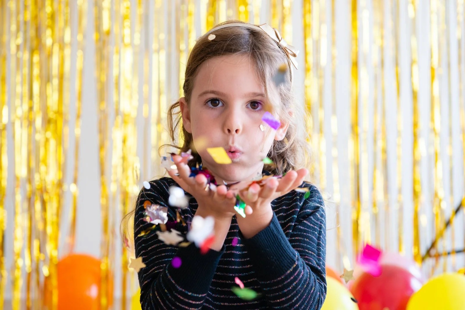 32-girl-blowing-confetti-kids-headshot-photographer.jpg