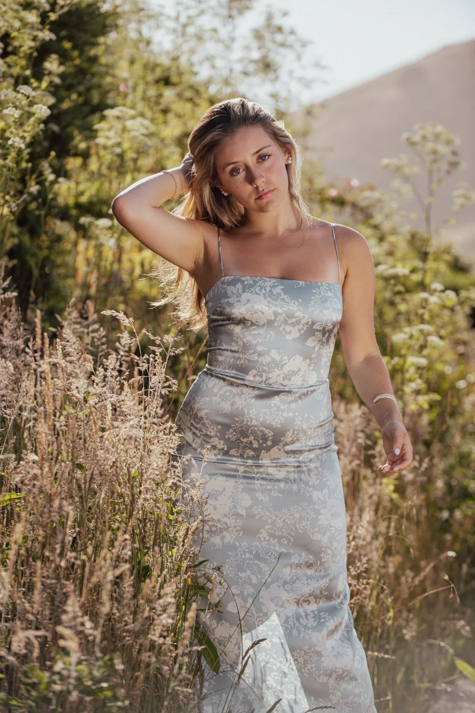 002-woman-posing-in-field-of-high-end-fashion-portraits.jpg
