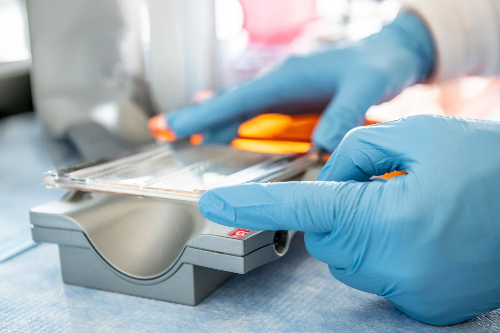 09-gloved-hand-pressing-scientific-research-photos.jpg