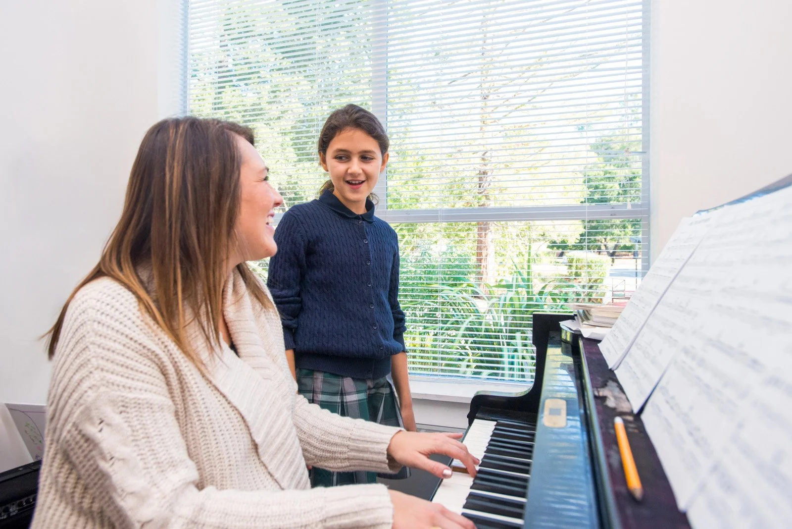 023-teacher-playing-piano-with-student-photos.jpg