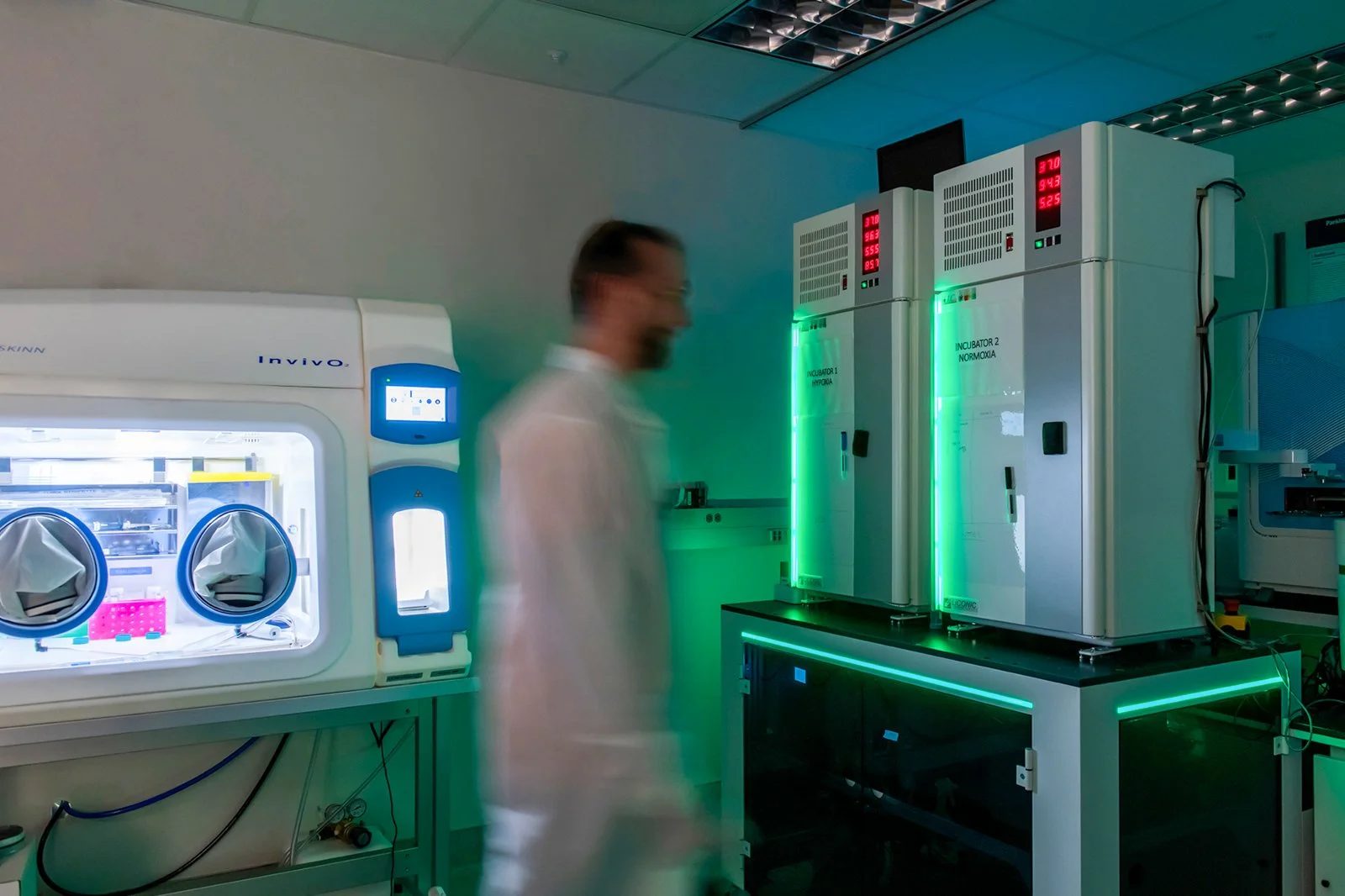 24-scientist-walking-past-chemistry-equipment-pictures.jpg