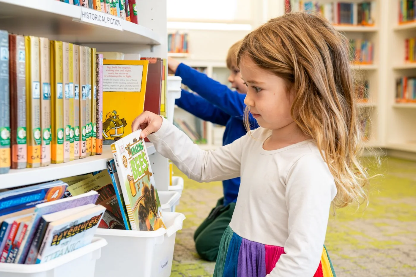003-young-girl-browsing-library-education-photoshoot.jpg