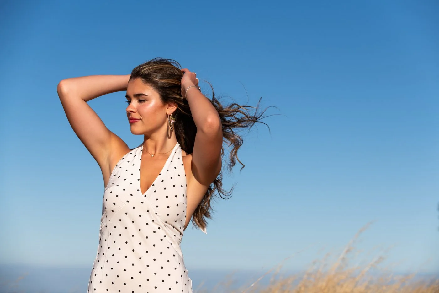 015-woman-posing-in-field-fashion-photo-shoot.jpg