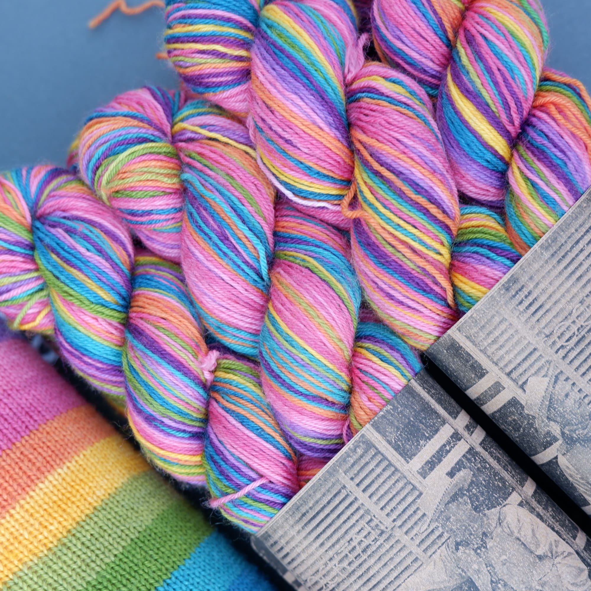 Self-striping sock yarn.Hand-dyed in 10 earthy wide striped rainbow colours.