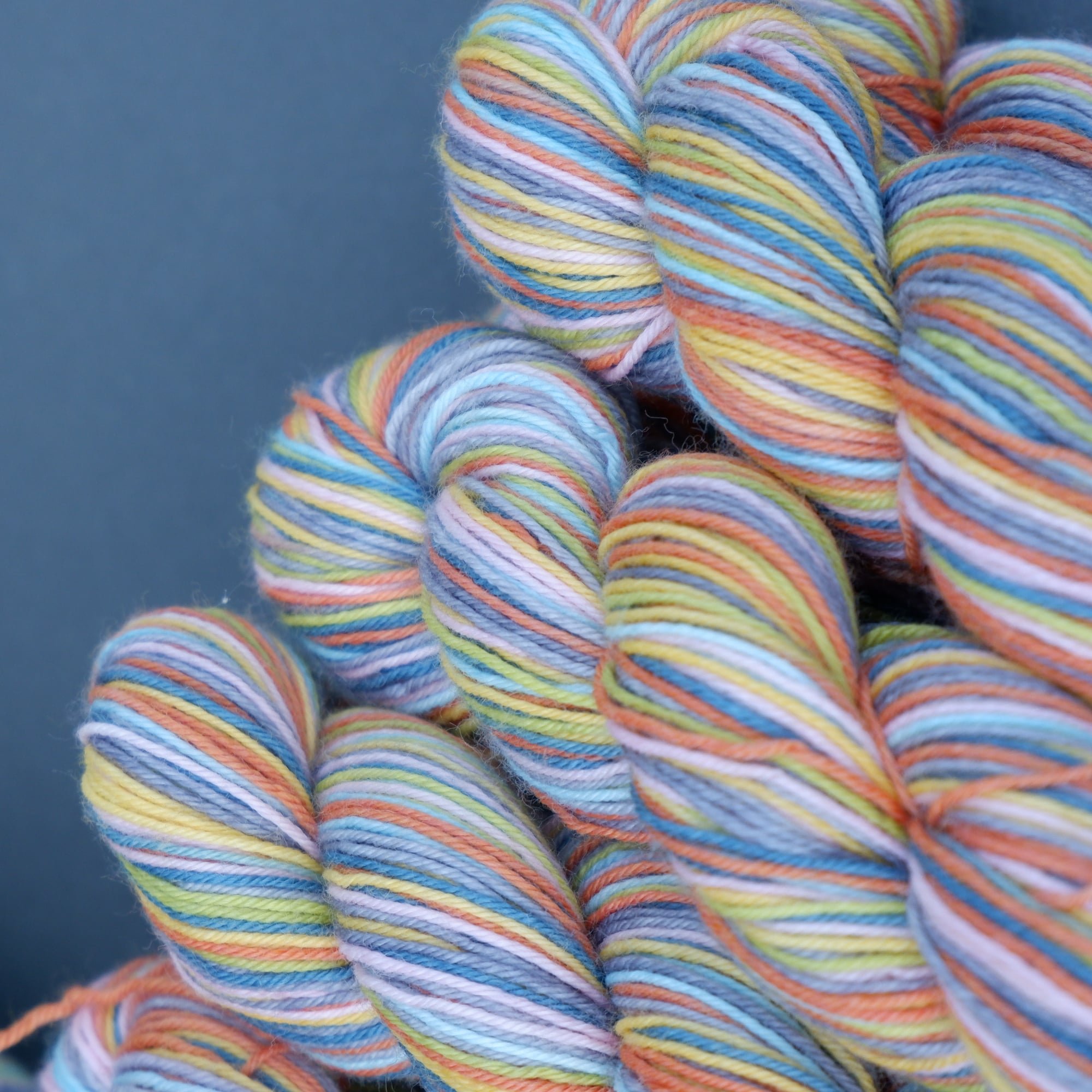 Self-striping sock yarn Hand-dyed in fine micro-stripes creates a chaotic colour way